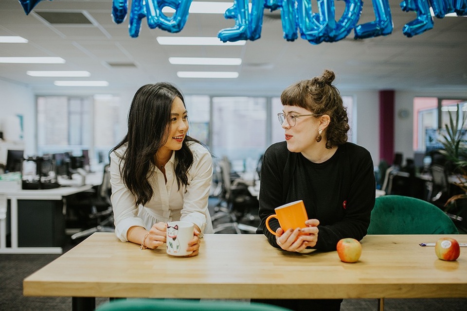 Manager talking openly during coffee with her employee