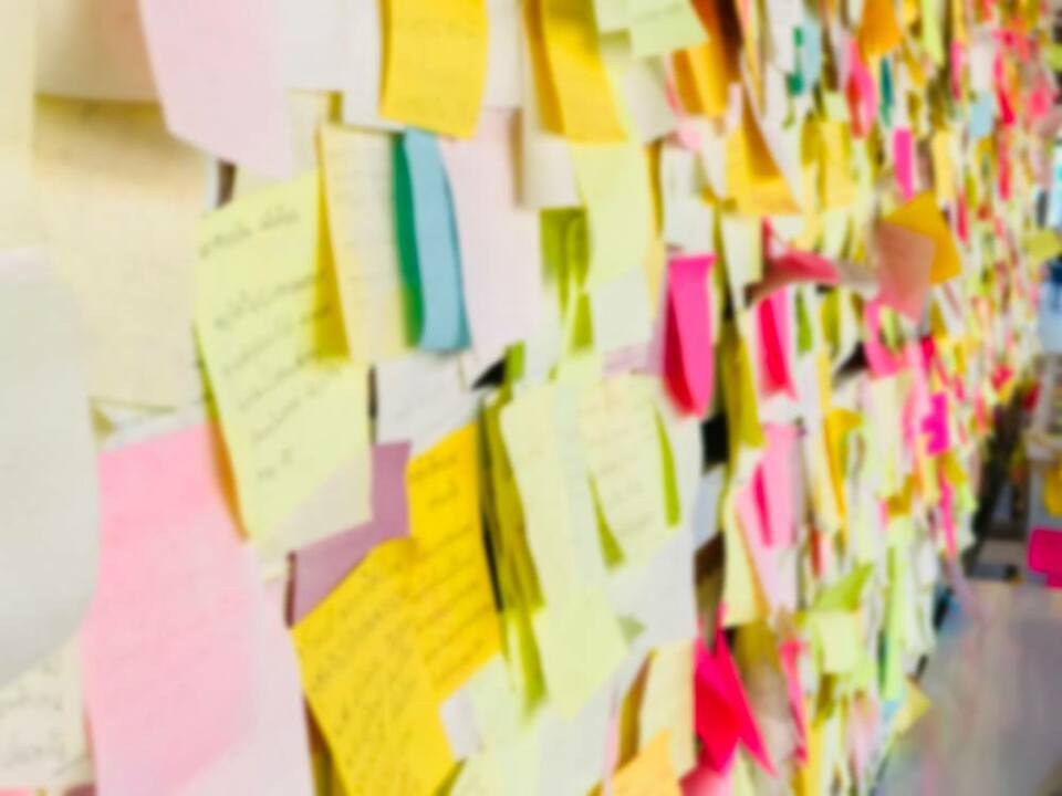 A wall full of multicoloured post-it notes