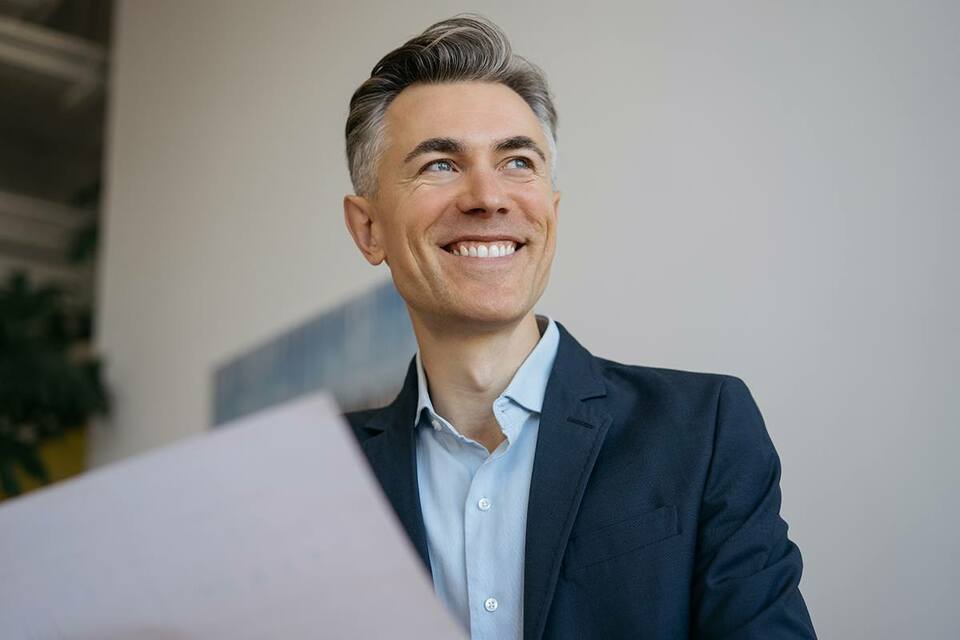 Confident employee smiling during a meeting