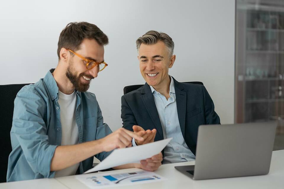 Reverse mentor and mentee working on a project together