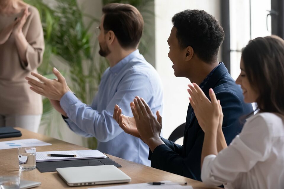 Teammates applauding each other on Employee Appreciation Day