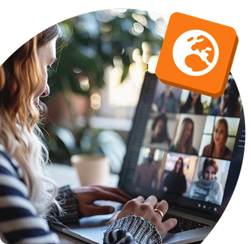 Person on a video call with a global team, using a laptop at home, with a globe icon symbolising remote work or international employee engagement.