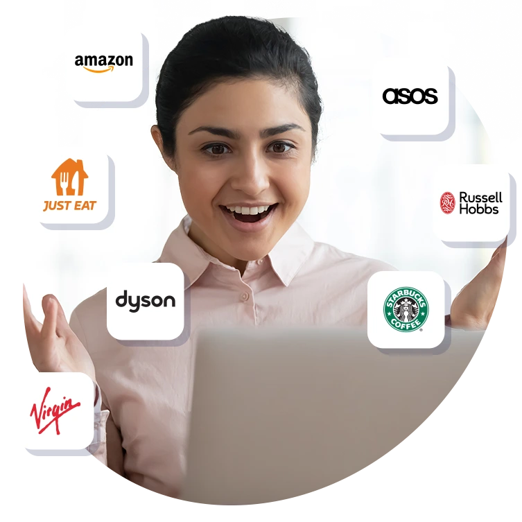 Smiling employee at laptop surrounded by brand logos like Amazon, Just Eat, and Starbucks, representing employee rewards and discount perks.