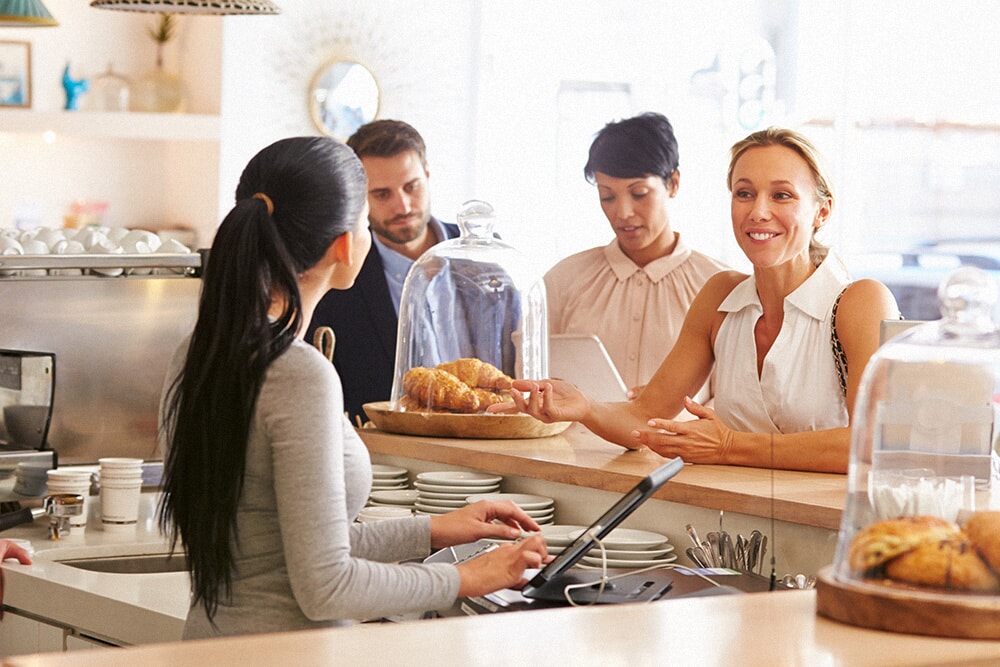  Line of people queuing at a cash register