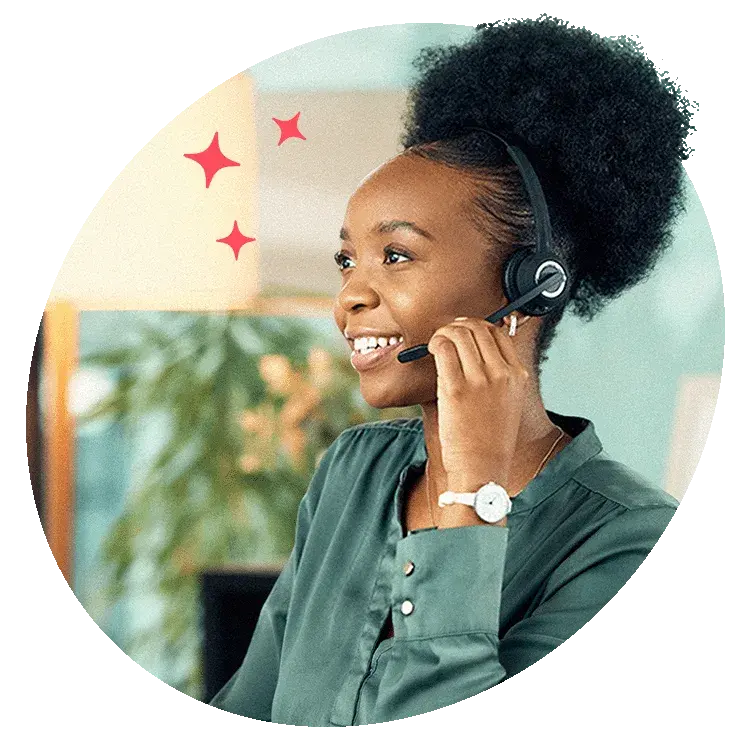 Customer support representative smiling while speaking on a headset, representing friendly and professional assistance.