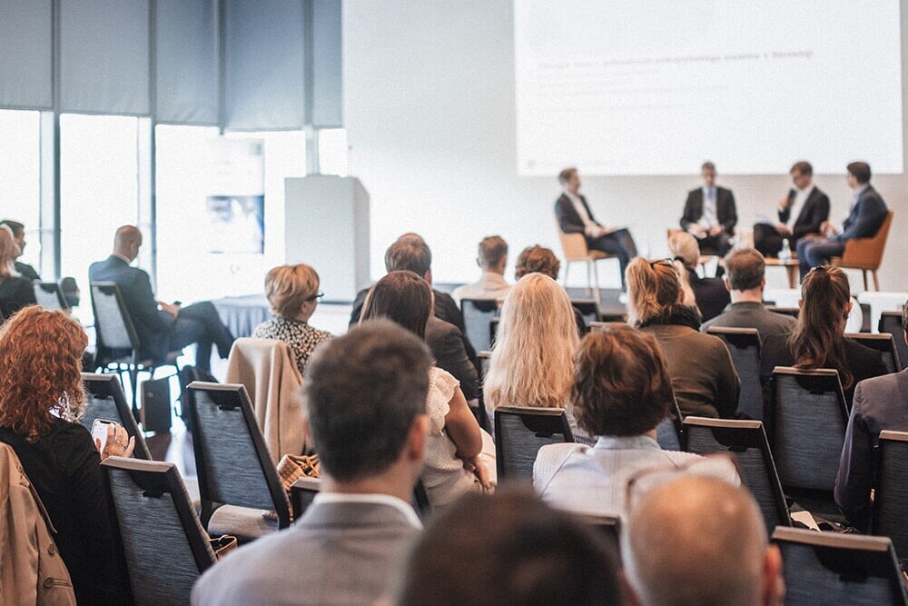 People in a big company meeting