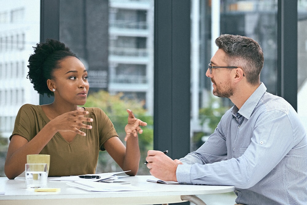 Person catching up with manager explaining something