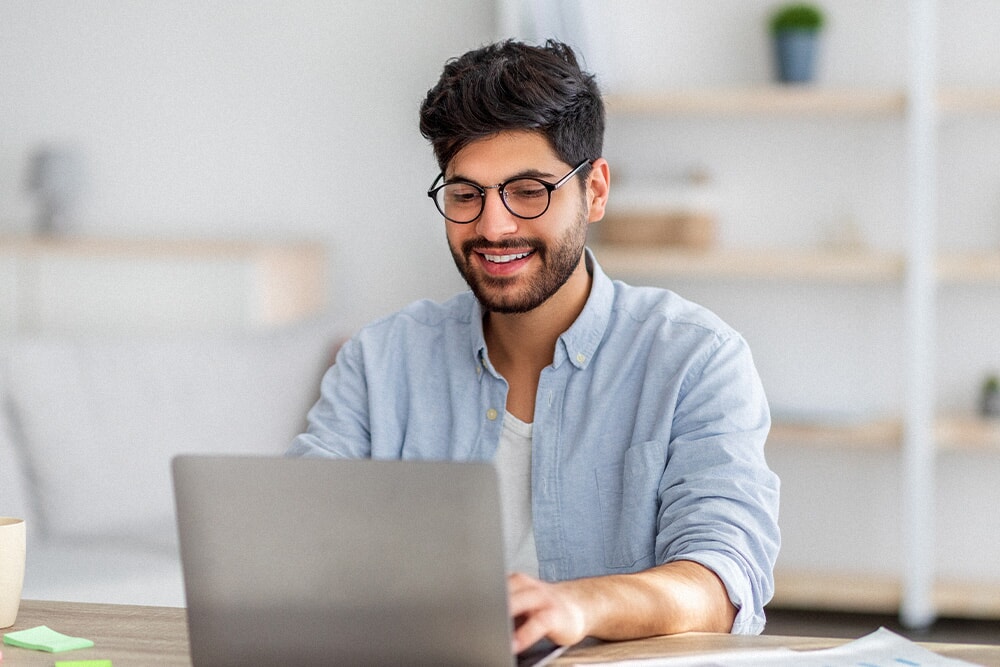 Someone at their computer looking like they are doing a course