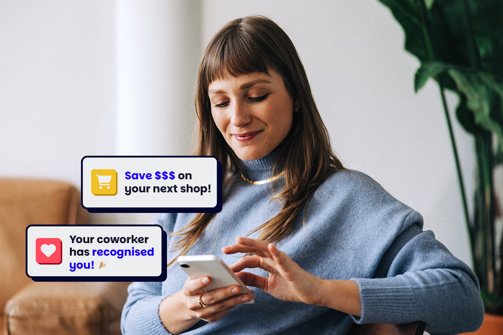 Someone on their phone with little Perkbox pop outs of Perkbox perks and recognitions