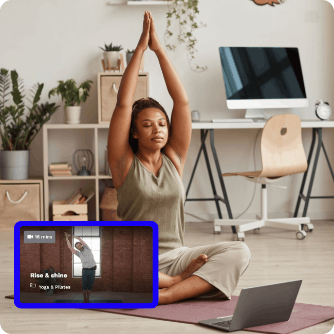 Employee following along with a virtual yoga class