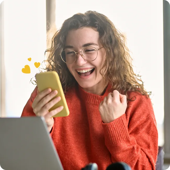 Employee smiling at their phone while using Perkbox