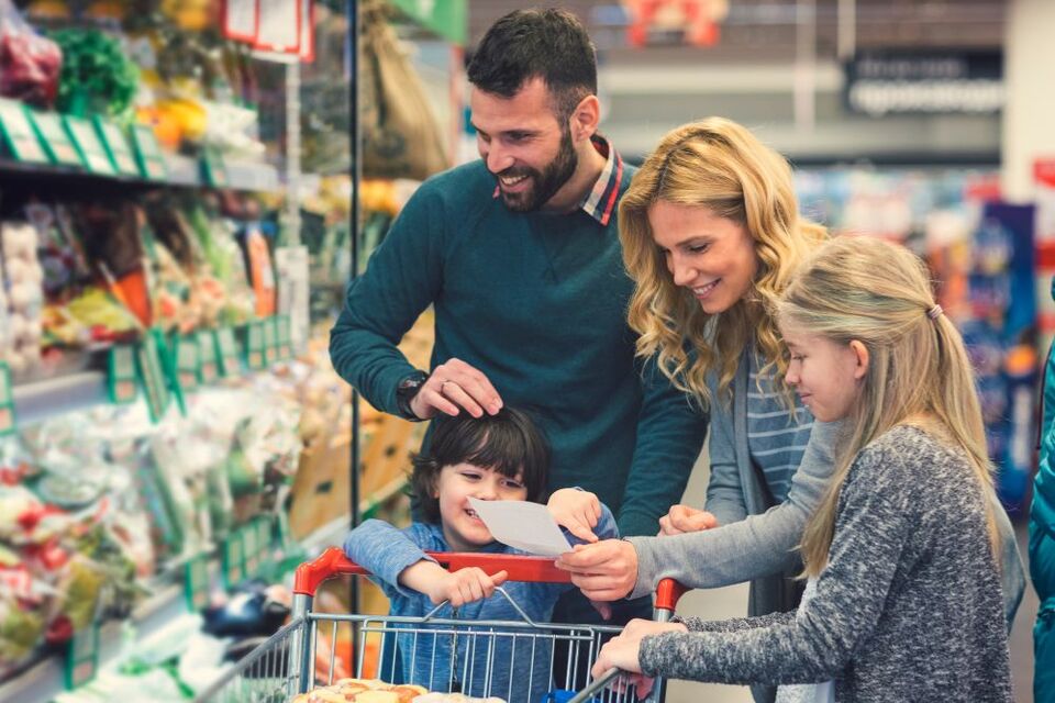 family in a supermarket doing a food shop