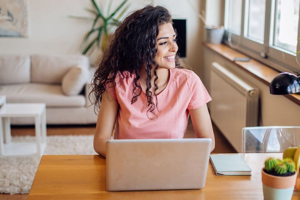 happy employee working from home alone