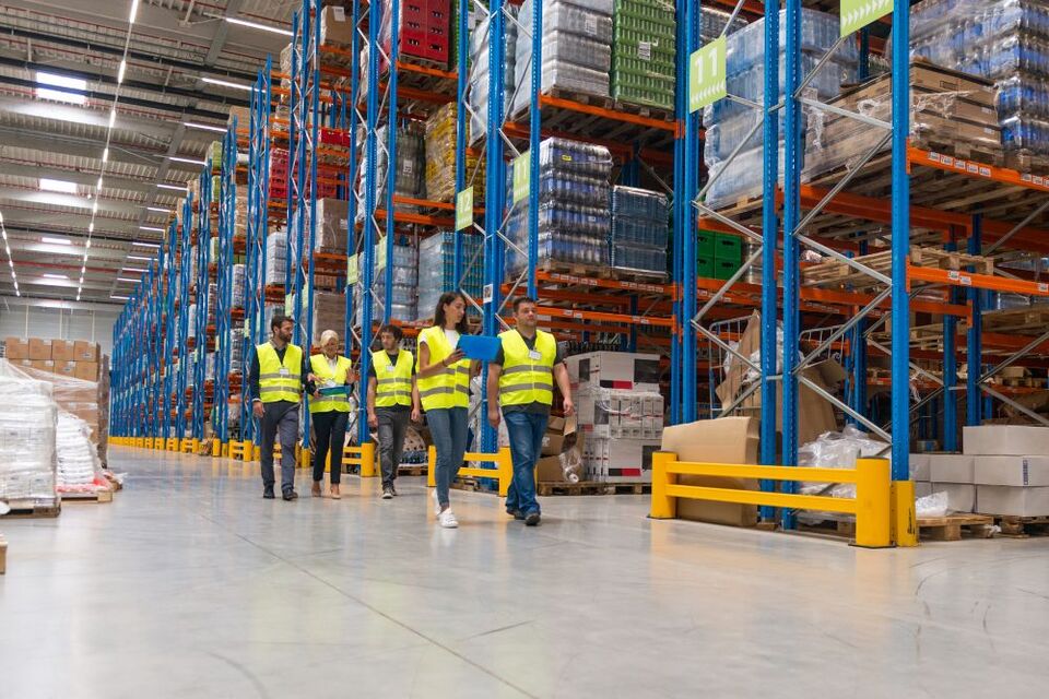 people walking in warehouse